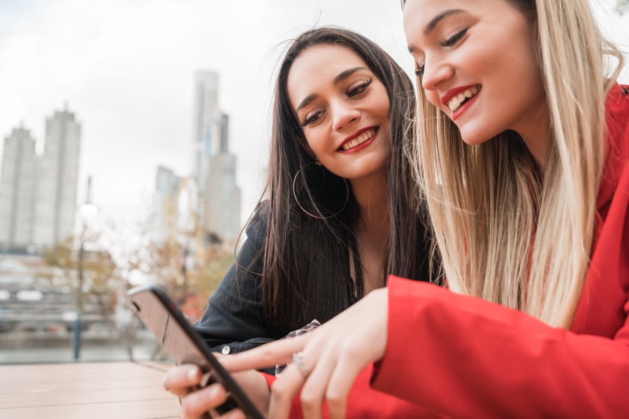 Two Female Friends Looking at Smartphone 